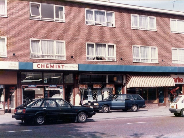 Part of a parade of shops on Upper Town Street in Bramley. They include Peter Morrell, chemist.