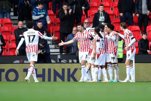 STOKE ON TRENT, ENGLAND - OCTOBER 21: Luke McNally (Hidden) of Stoke City celebrates with teammates after scoring their side's second goal during the Sky Bet Championship match between Stoke City and Sunderland at Bet365 Stadium on October 21, 2023 in Stoke on Trent, England. (Photo by Jess Hornby/Getty Images)