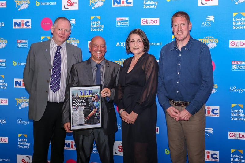 YEP competition winner Phil Abrahamson presents the Magic Moment award to Rhinos operations director Sue Ward, watched by Evening Post writer Peter Smith (left) and Bob Bowman, of the Rhinos Foundation. Bowman and Ward were key organisers of the Rob Burrow Leeds marathon which was voted Rhinos' 2023 Magic Moment.