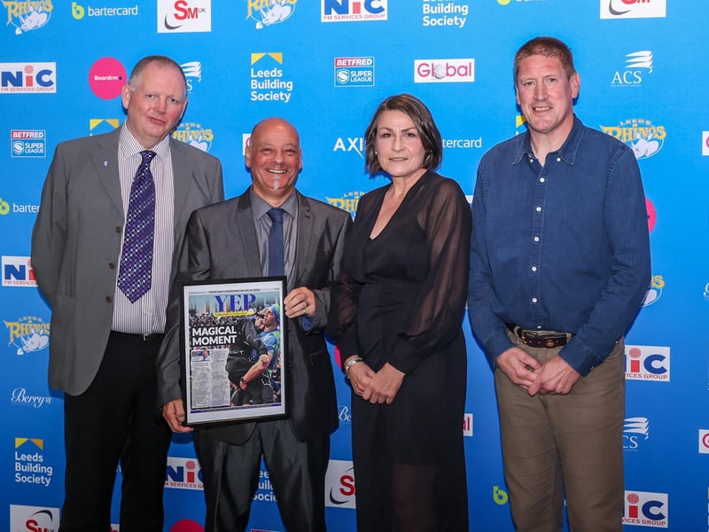 YEP competition winner Phil Abrahamson presents the Magic Moment award to Rhinos operations director Sue Ward, watched by Evening Post writer Peter Smith (left) and Bob Bowman, of the Rhinos Foundation. Bowman and Ward were key organisers of the Rob Burrow Leeds marathon which was voted Rhinos' 2023 Magic Moment.