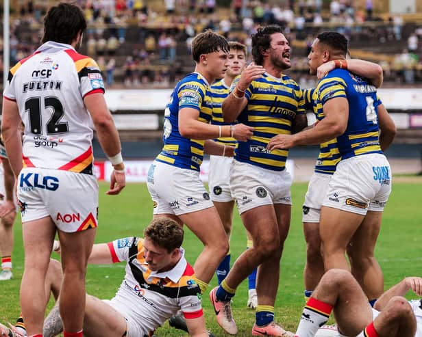James Bentley, centre of picture, celebrates during Warrington Wolves' win at Bradford Bulls last week. Picture by Alex Whitehead/SWpix.com.