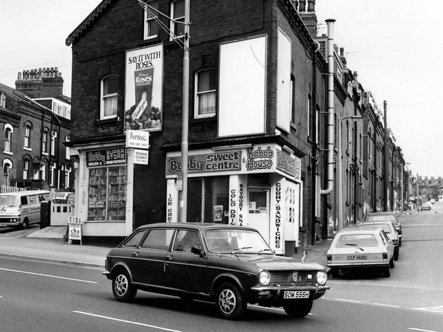 Bobby Superstore on Roundhay Road in April 1980. Next door is Bobby Sweet Centre and Kebab House offering ice cream, cold drinks, savoury snacks, curry and sandwiches. Homes in Bayswater Terrace can be seen left and Bayswater Row is on the right.