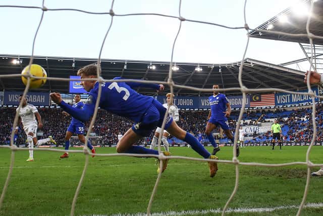 CARDIFF, WALES - JANUARY 08: Joel Bagan of Cardiff City handles the ball leading to a red card and penalty being awarded during the Emirates FA Cup Third Round match between Cardiff City and Leeds United at Cardiff City Stadium on January 08, 2023 in Cardiff, Wales. (Photo by Michael Steele/Getty Images)