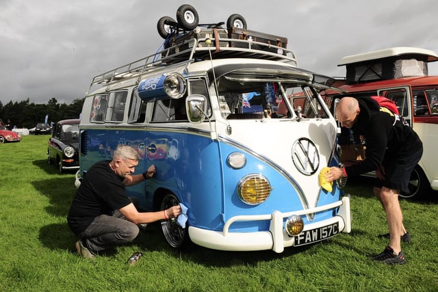 Mark McGrath, of Oakwood, cleans his 65 split-screen campervan with his friend Mick Wright