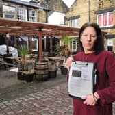 Mel Green, 44, is the landlady of The Black Bull pub, in Otley, which has been told by Leeds City Council that it must remove its sheltered seating area - while a petition in favour of the structure racks up more than 1,000 signatures. Photo: Steve Riding.