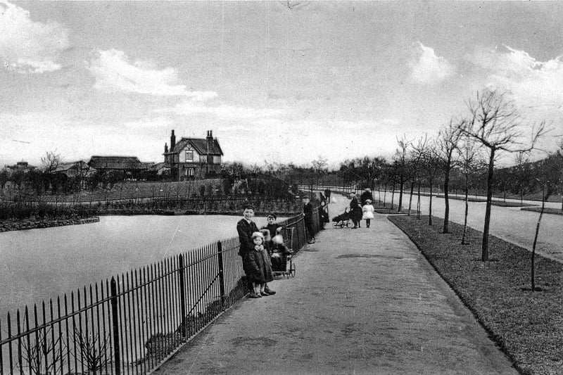 A postcard view of East End Park with a postmark of September 22, 1913. The artificially created lake is seen on the left while Victoria Avenue, which runs through the park, is on the right. The park keeper's cottage is visible in the background.