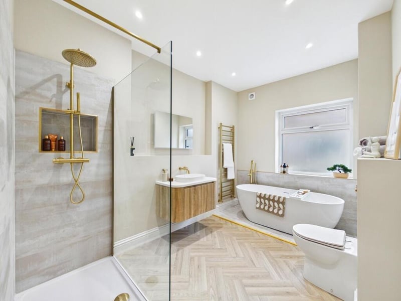 The bathroom comprises of a free standing double end bath, a wash hand basin with storage below, a shower cubicle with a mains feed waterfall shower and a w.c. with a low level flush.