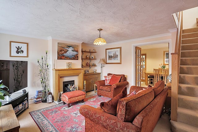 The entrance porch leads straight through to the spacious lounge with fireplace.