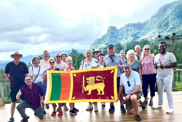 Travelsphere Highlights of Sri Lanka tour party fly flag for accommodating nation
