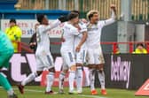 GOING THROUGH: Leeds United celebrate Junior Firpo's strike at Accrington. Picture by Bruce Rollinson