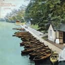 A colour-tinted postcard view of Roundhay Park showing Waterloo Lake with one of its two boathouses in the foreground. A large number of boats are lined up along the edge of the lake. The postcard is franked with the date May 29, 1908.