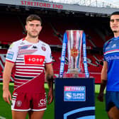 Wakefield Trinity forward Caleb Hamlin-Uele and Brad O'Neill, of Wigan Warriors, with the Betfred Super League trophy at Old Trafford. Picture by Allan McKenzie/SWpix.com.