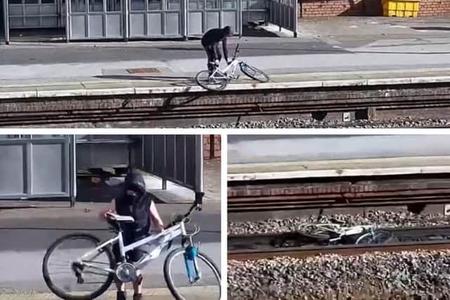 Still captured from the shocking CCTV footage issued by Network Rail, showing two youths throwing a bicycle onto railway tracks at Cross Gates train station.