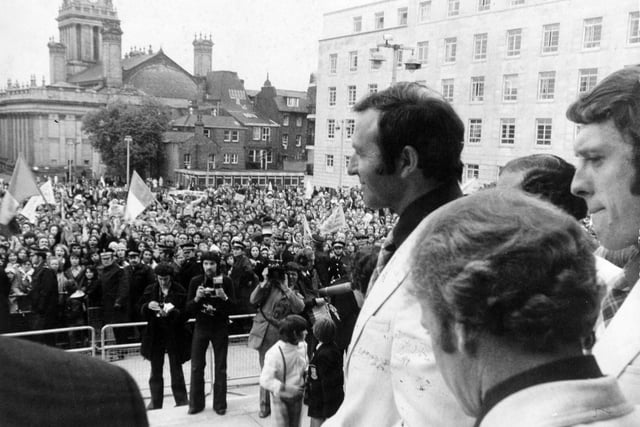 Leeds United manager Jimmy Armfield leads out the team to greet supporters on the steps of Leeds Civic Hall arfter the team arrived back from Paris in May 1975.