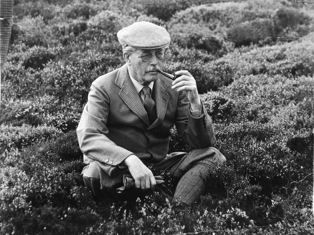 Prime Minister Harold MacMillan relaxes smoking a pipe on isolated Grimesgill Moor at Masham in August 1960.