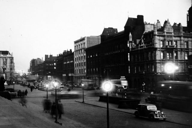 The Headrow at dusk in November 1948.