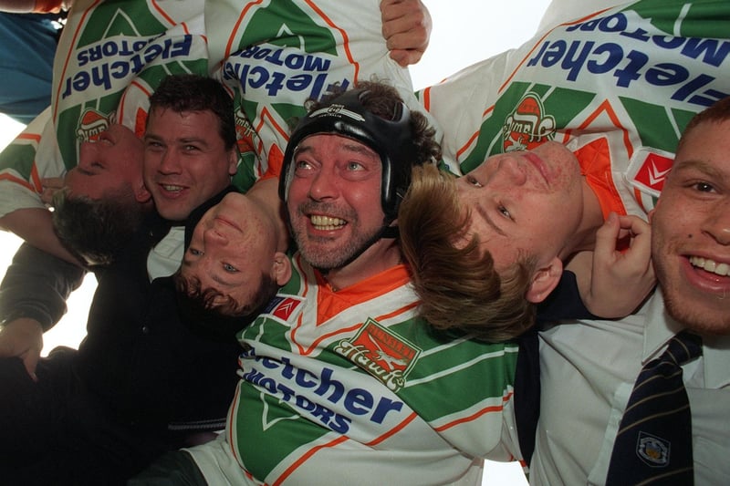 TV prankster Jeremy Beadle finds life tough in the scrum in November 1996 with some of the youngsters from Hunslet Parkside (all upside down), and James Lowes, left, and Marvin Goulden, right. He was at South Leeds Stadium to surprise junior rugby league coach Colin Cooper, whose proteges included Lowes and Goulden as well as Garry Schofield, Sonny Nicol and Jason Robinson.