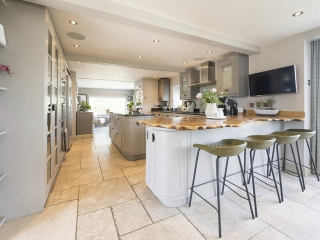 The hand-made wooden kitchen has French doors to an outside patio.
