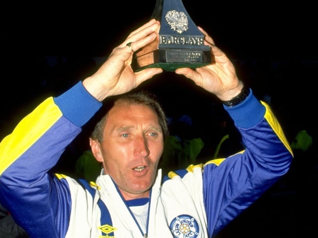 8 May 1990: Leeds United manager Howard Wilkinson lifts the Division Two Championship trophy after victory in the match against Bournemouth at Dean Court in Bournemouth, England. \ Credit: Dan Smith /Allsport