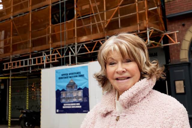 Cllr Denise Jeffery in front of 6-8 Silver Street, which scientists think may be the oldest timber framed in Wakefield. Photo: John Clifton