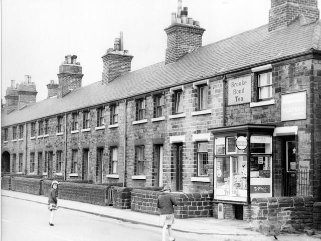 Springfield View, which consisted of a row of terraced houses on Victoria Road. To the right are the premises of F. Cardwell, General Store. Signs in the window and at the front of the property include 'Brooke Bond Tea', 'Capstan', 'Typhoo Tea' and 'Players'. Pictured in April 1967.