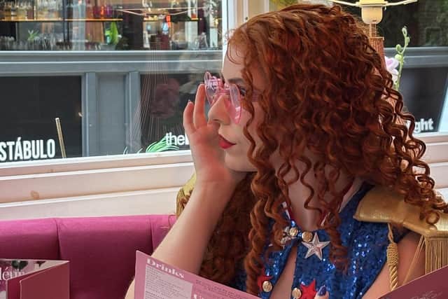'Chappell Roan' browses the menu in Fleur Restaurant, The Light, Leeds