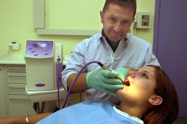 Dentist Wiktor Malach was using a new pain free gas based procedure in August 2002 at his Austhorpe Road practice. He is pictured using the new treatment on Sarah Kelly.