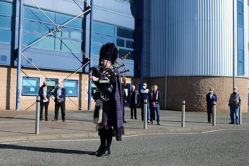 A piper at the funeral procession outside Falkirk Stadium (Pic: Michael Gillen)