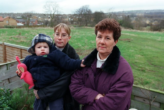 Sara Hayes and Josh, 2, and Ann Barker who were complaining in February 1999 about plans to build in the field at the bottom of their garden in Guillemot Approach.