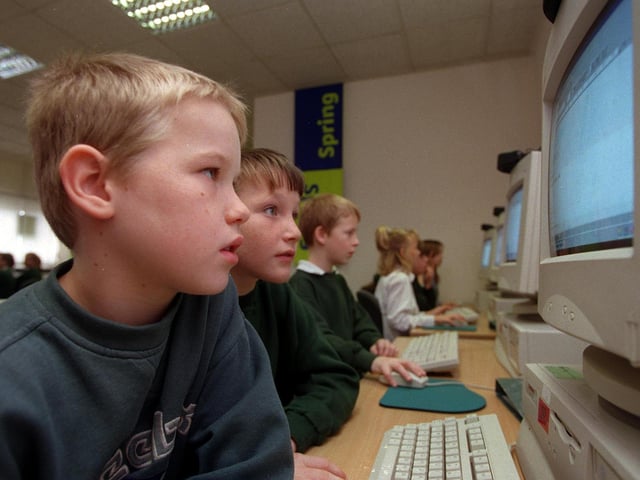 Children from Westwood Primary School in the computer room at Middleton Park High in November 1998.