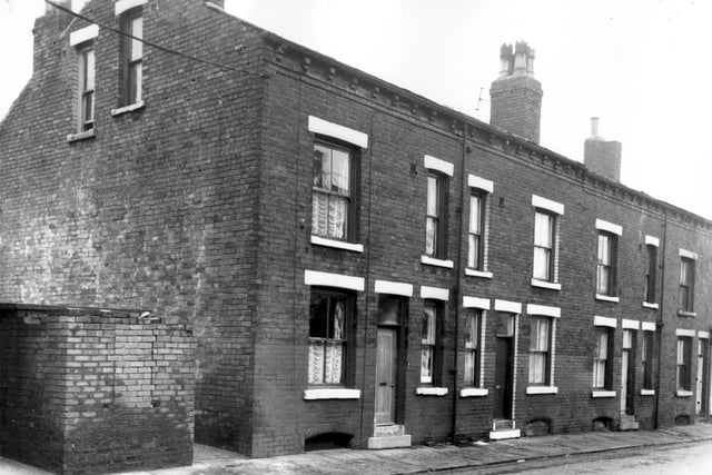 Four double fronted back-to-back terraced houses on Ascot Street with a yard on the left originally built to house a shared toilet and midden. Pictured in October 1966.