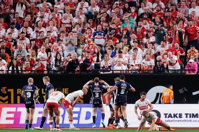 The Leeds Rhinos fan on the front row at the Hull KR end in Allegiant Stadium seems to be enjoying Harry Newman's celebration, but the Robins supporters around him appear less impressed. Picture by Alex Whitehead/SWpix.com.