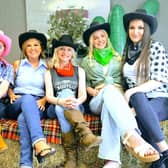 Colleagues from Cookridge Court embracing the western themed event