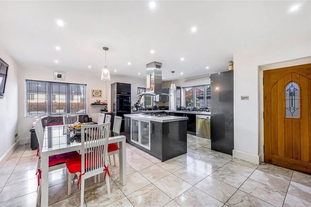 The heart of this home is the superb open plan kitchen/diner with marble tiled flooring throughout, a central island, fitted wall and base units, integrated Neff ovens and an AEG six ring gas hob.