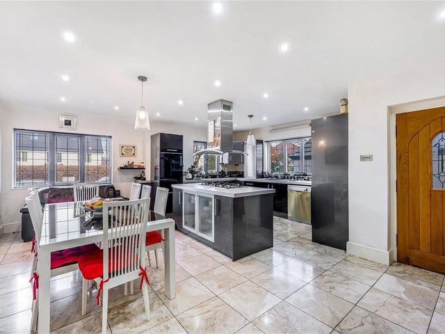 The heart of this home is the superb open plan kitchen/diner with marble tiled flooring throughout, a central island, fitted wall and base units, integrated Neff ovens and an AEG six ring gas hob.