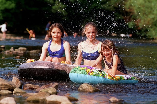 Youngsters cooling off in the River Wharfe near Ilkley in July 1999. Pictured, from left, are Katie Black, Emily Black and Hannah Adamson.