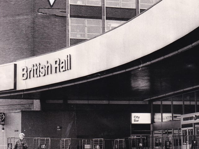 March 1971and an arrow indicates where brickwork was falling off City House at Leeds City Station. Trolleys were used to close off the danger area.