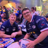 Fan Richard Lawley with Leeds Rhinos' Jeremiah Mata'utia and Lachie Miller.