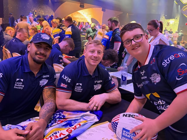 Fan Richard Lawley with Leeds Rhinos' Jeremiah Mata'utia and Lachie Miller.
