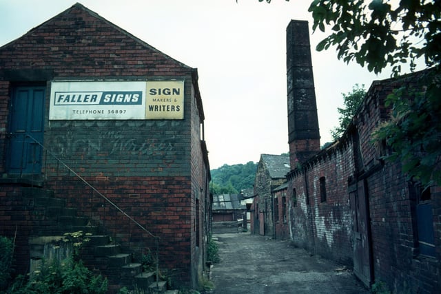 Derelict buildings of Woodlands Dyeworks on Wood Lane in Meanwood shortly before demolition in July 1975 . Known as Crowther's Mill and previously Rowley's Mill and Wood's Mill, there is believed to have been a mill on the site since 1601. The building in the foreground here was also more recently occupied by Faller Signs, sign makers and writers. In 1974 Leeds City Council took over the site and the mill was subsequently demolished.