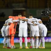 TV cameraman gets a close-up view of the Leeds' huddle ahead of the English Premier League football match between Leeds United and Wolverhampton Wanderers at Elland Road