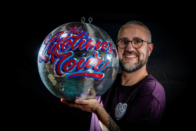 Leeds based Mirrorball artist and signwriter Kieran Hadley with his mirrorball for American singer, songwriter, Katy Perry on her current world tour 'The Lifetimes Tour'. Photograph by Tony Johnson.