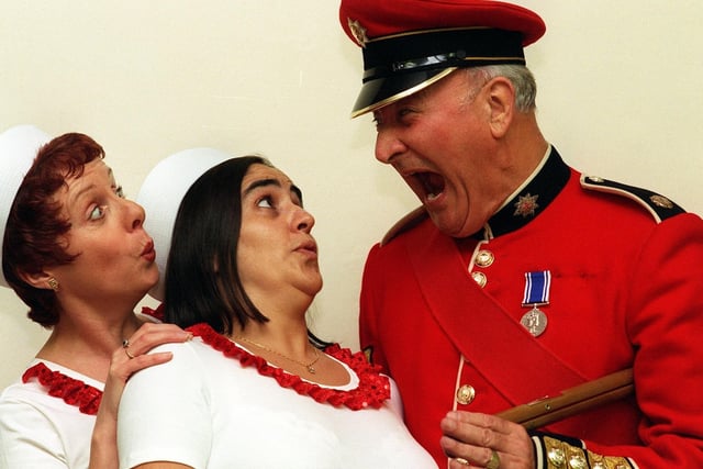 Former drill instructor with the Coldstream Guards and now a member of Leeds Amateur Operatic Society Roy Walker gets the girls into shape for a production of 'The Musical Years'. He is pictured with cast members Janet Page (left) and Nadia Murrell.