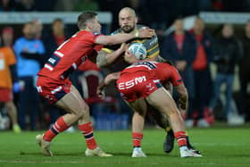 George Griffin, pictured being tackled by Hull KR's Matt Parcell and Jez Litten, has signed a new long-term contract with Castleford Tigers. 
Picture by Bruce Rollinson