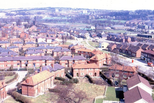 A view from the high rise flats on Wyther estate showing Armley Ridge Road to the right, running down to Amen Corner, and the bridge over the canal. Headingley RUFC ground is to the right with Thrift Stores on Bridge Road beyond it. Housing on the Raynville's and Houghley's are in the foreground to the left. The high rise flats from where the photograph was taken were built in the grounds of Wyther House.