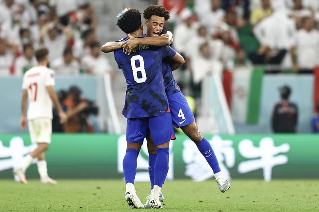 Adams and Weston McKennie celebrate passage to the Last 16 (Photo by Tim Nwachukwu/Getty Images)