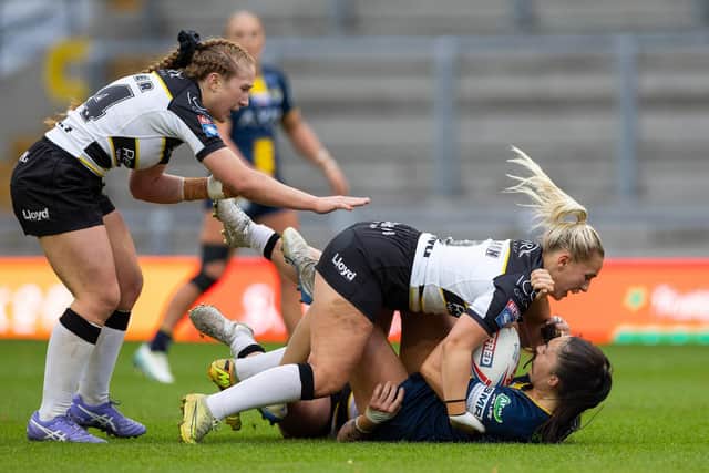 Leeds Rhinos' Ruby Enright is tackled during the Women's Super League semi-final defeat by York Valkyrie. Picture by Callum Pilkington/SWpix.com.