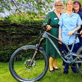 Michelle (centre) will be pedalling for 24 hours to raise money for good causes