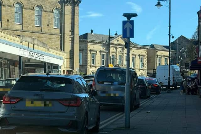Cars parked on double yellow lines in Batley town centre