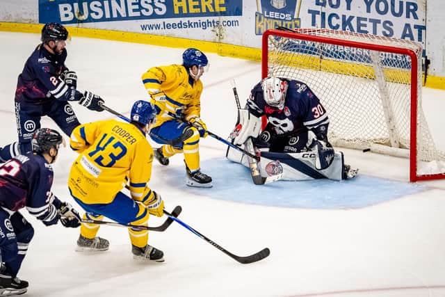 STRIKE TWO: Oli Endicott guides the puck through the legs of Peterborough goalie Hayden lavigne during Leeds Knights' 6-2 win on Saturday night. Picture: Ben Gordon/Knights Media.
